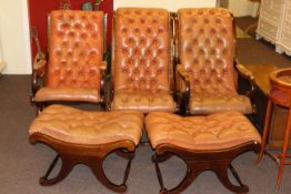 Three buttoned leather scroll arm X-framed chairs including one rocker and two stools to match.