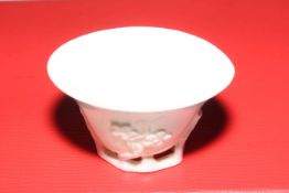 Antique Chinese libation cup with relief prunus decoration, 9cm across.