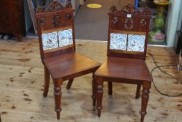 Pair Victorian mahogany hall chairs with Minton? tiled inset backs.