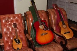 Mandolin, 1970's Western acoustic and another guitar.