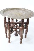 Circular brass, copper and silvered Islamic folding coffee table, 48cm by 51cm diameter.