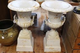 Pair cast Campana style garden urns on stepped bases, 85cm by 46cm diameter.
