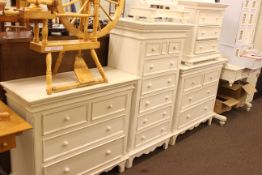 White washed six piece bedroom suite comprising four chests of drawers, washstand and toilet mirror.