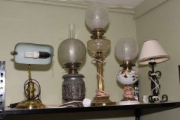 Brass desk lamp, three assorted oil lamps (all converted to electric) and a table lamp (5).