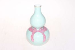 Chinese double gourd vase with ribbon decoration on pale blue ground, six character mark, 19.5cm.