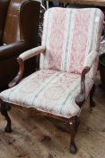 Open armchair on cabriole legs to claw feet in classical striped fabric.