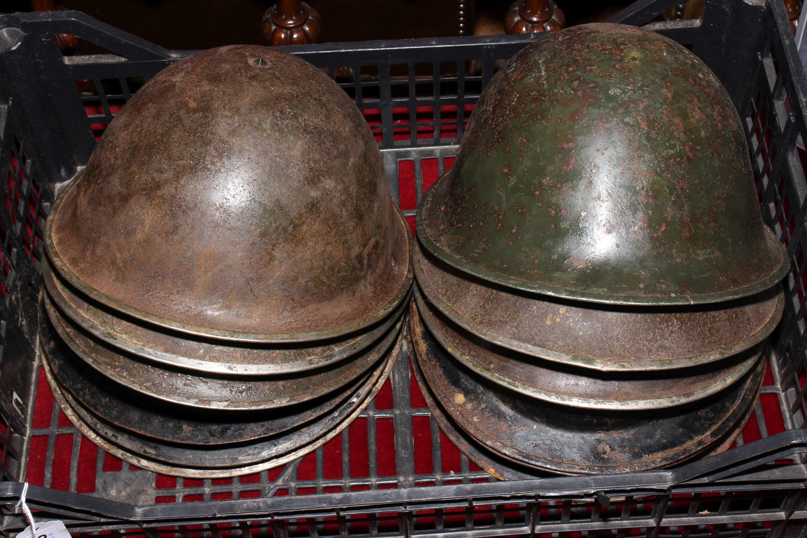 Collection of twelve military helmets.