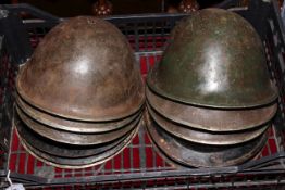 Collection of twelve military helmets.