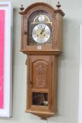 Colin 'Beaverman' Almack carved oak arched top wall clock, 100cm.