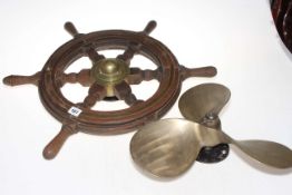 Six spoke ships wheel and propeller.