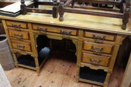 Late Victorian aesthetic seven drawer kneehole desk, 76.5cm by 137cm by 52cm.