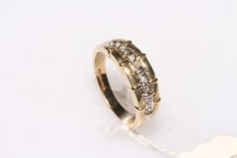 9 carat gold diamond ring, set with row of eight tiny diamonds, size K.