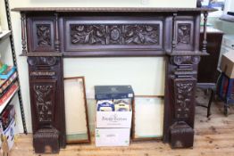 Late 19th/early 20th Century carved oak fire surround, 129cm by 165cm by 30cm.