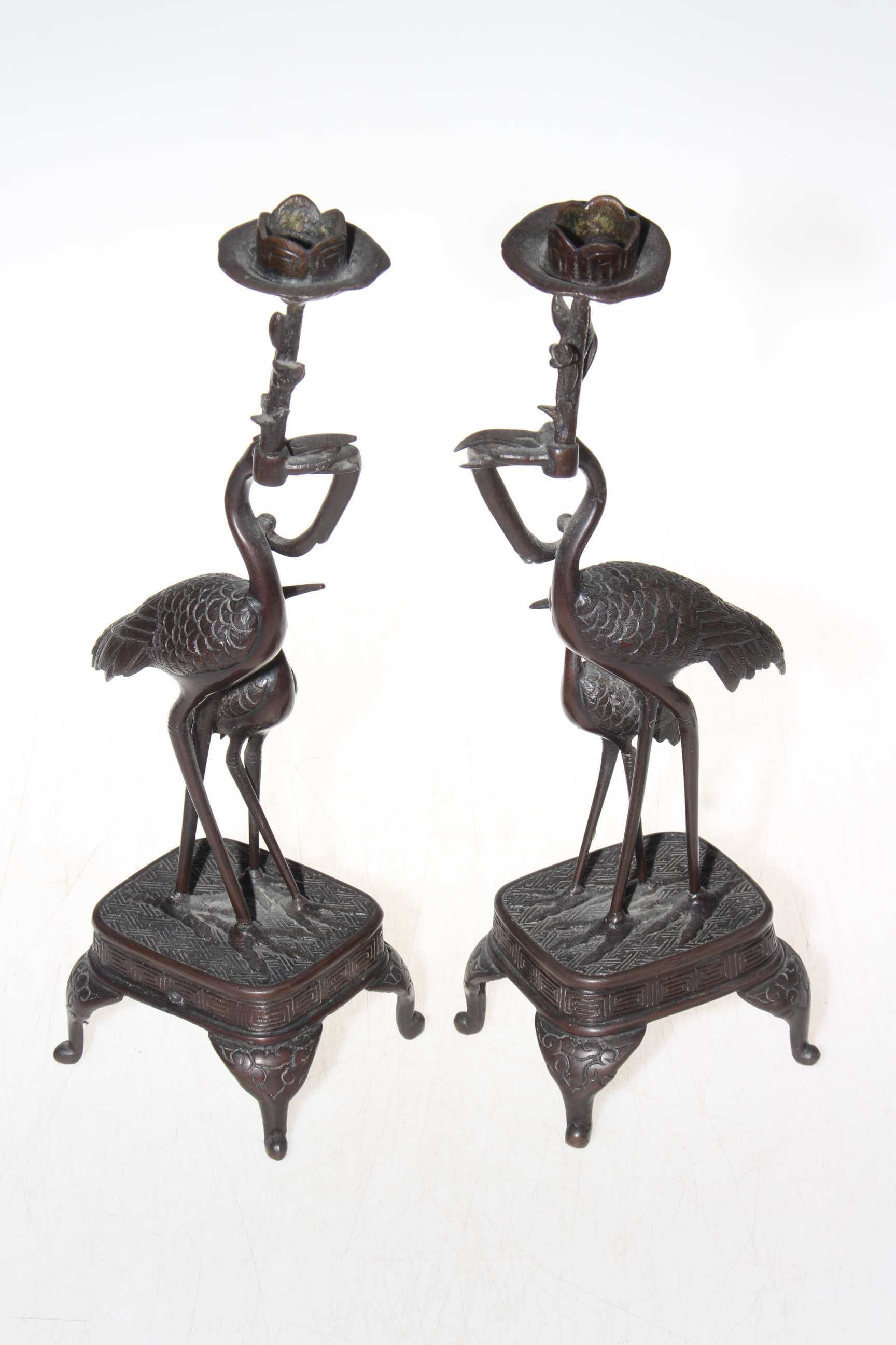 Pair bronze stork candlesticks, 25cm.