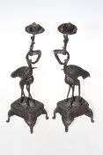 Pair bronze stork candlesticks, 25cm.