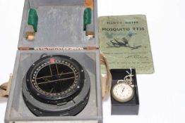 WWII Mosquito compass, Air Ministry stopwatch, and Mosquito pilots manual.