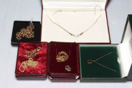 9 carat gold jewellery comprising boxed necklace, garnet pendant, diamond pendant and three chains.