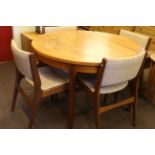 Teak circular extending dining table and four chairs.