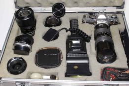 Canon AE-1 camera, five lenses, flash gun and accessories in aluminium flight case.