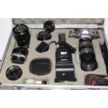 Canon AE-1 camera, five lenses, flash gun and accessories in aluminium flight case.