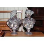 Pair of Romanesque male and female bronze effect busts of Apollo and Diana.