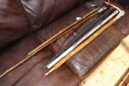 Japanese carved bone walking stick and four others.