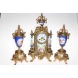 Continental ornate gilt metal and porcelain three piece clock set decorated with classical scene