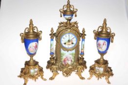 Continental ornate gilt metal and porcelain three piece clock set decorated with classical scene