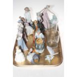 Four Lladro figures, Butterfly and Nesting Crane, two Nao figures,