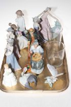 Four Lladro figures, Butterfly and Nesting Crane, two Nao figures,