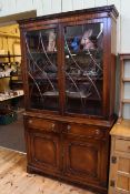 Siesta mahogany four door cabinet bookcase, 206cm by 115.5cm by 40cm.