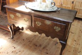 Georgian oak two drawer dresser on cabriole legs, 76cm by 124cm by 47.5cm.