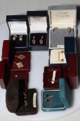 Collection of nine pair of boxed gold earrings.