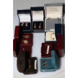 Collection of nine pair of boxed gold earrings.