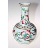 Large Chinese bottle vase with peach tree decoration, overglaze iron red six character mark, 39cm.