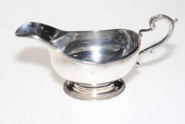 Silver sauce boat with beaded handle and borders, London 1968.