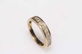 Diamond set 9 carat gold half eternity ring, size K.