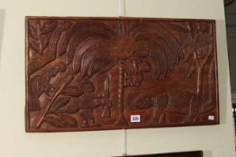 Haitian carved folk art hardwood panel, 36cm by 64cm.