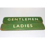 Pair of enamel Ladies and Gentleman rest room signs.