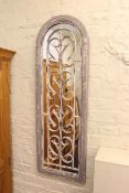 Arched and wrought iron rectangular wall mirror, 123cm by 40cm.