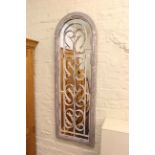 Arched and wrought iron rectangular wall mirror, 123cm by 40cm.