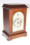 Edwardian inlaid mahogany mantel clock with silvered dial.