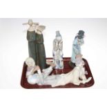 Five Lladro figures including Clown, Eskimo Child, Japanese Lady, Nun Group and Cascades Clown.