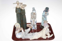 Five Lladro figures including Clown, Eskimo Child, Japanese Lady, Nun Group and Cascades Clown.