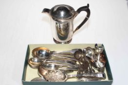 Collection of EP flatware including pair berry spoons and water jug.