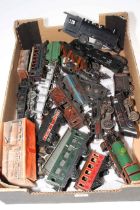 Box of clockwork model railway trains and carriages.