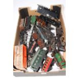 Box of clockwork model railway trains and carriages.