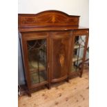 Edwardian mahogany and satinwood inlaid bow front centre three door vitrine, 150cm by 137cm by 39cm.