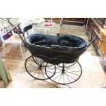 Victorian baby carriage, the under carriage with makers name and dated 1887.