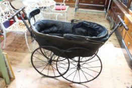 Victorian baby carriage, the under carriage with makers name and dated 1887.
